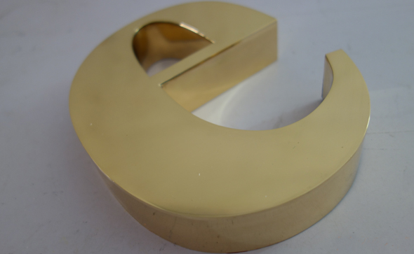 Polished mirror surface brass signs