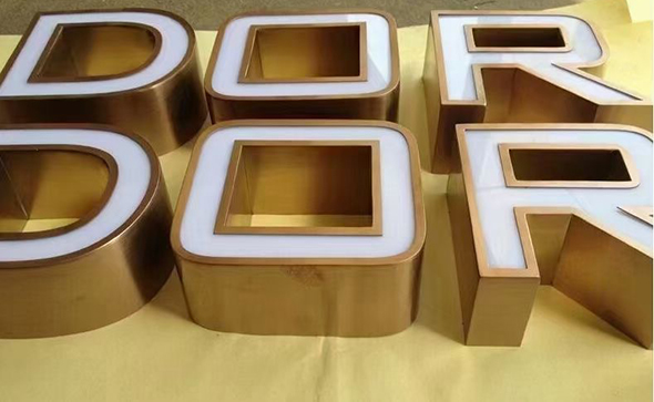Electroplated stainless steel signs