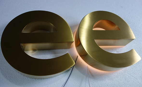 Backlit stainless steel signs