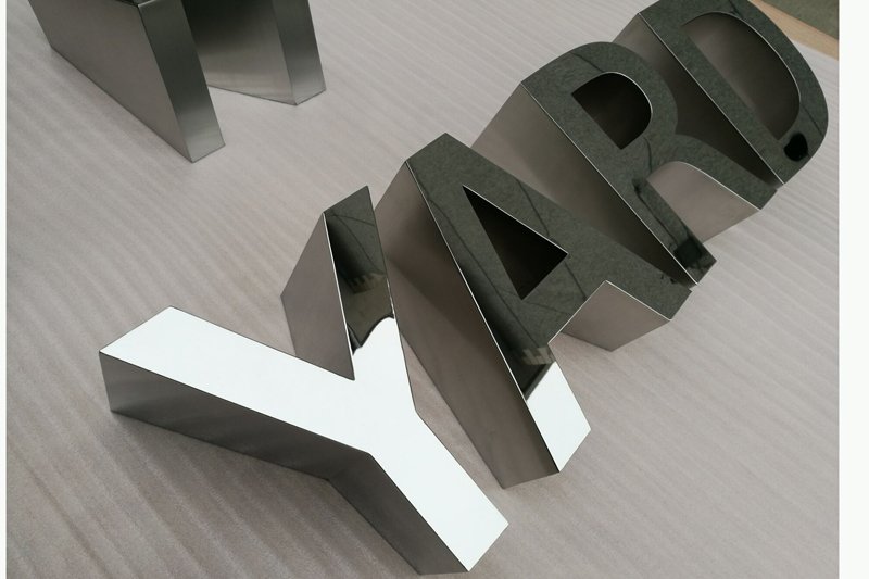 Beveled surface signs